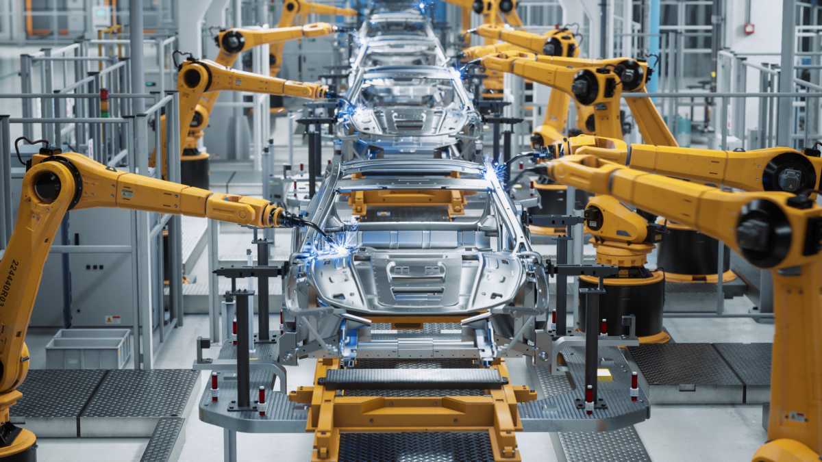 Robots in a car assembly line.