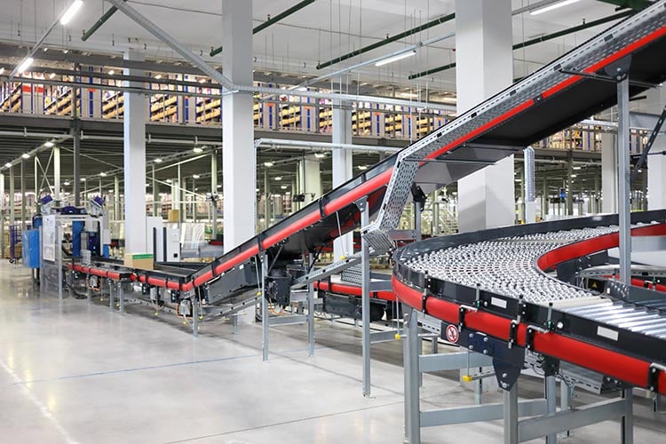 automated belts run through low volume production facility