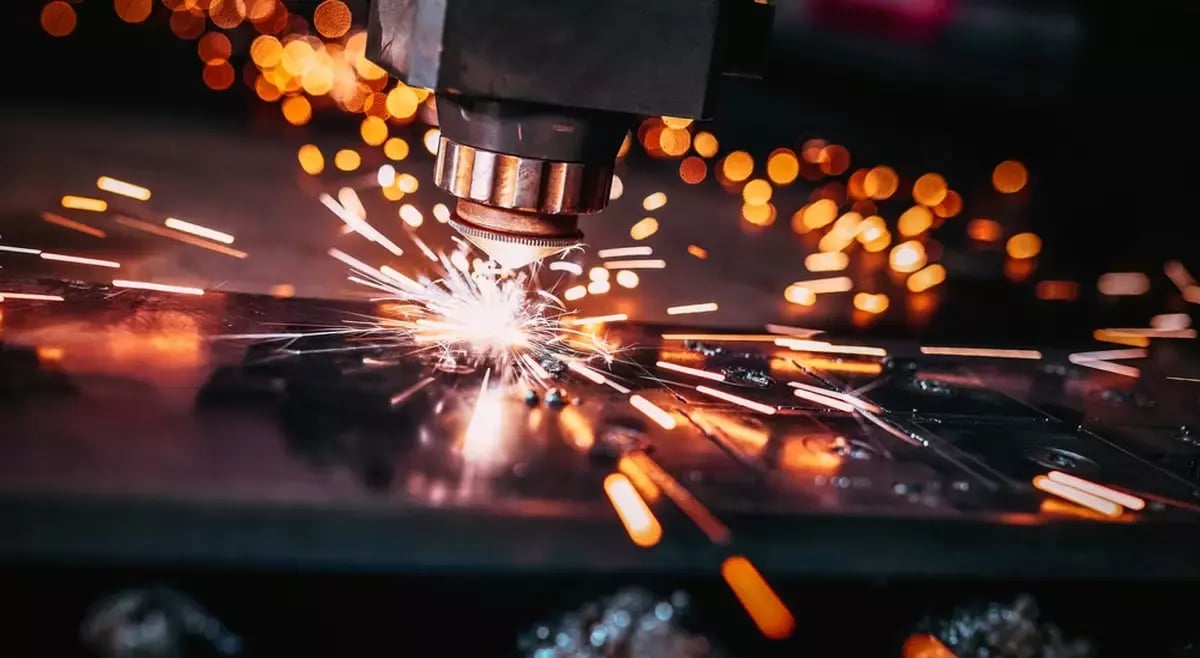 CNC Laser cutting of metal close up, modern industrial technology.