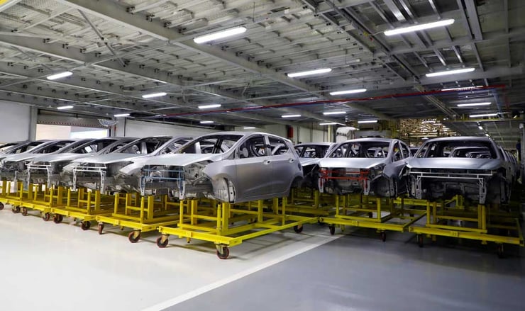 A manufacturing production setting filled with cars 
