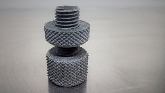 A small 3D printed piece made by additive manufacturing & engineering services