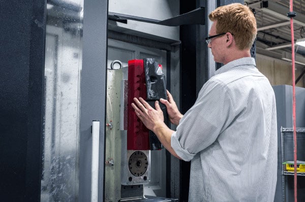 A man beginning a compression molding