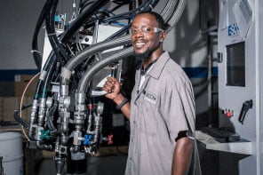 A worker in RCO's foam molding facility smiles for the camera. 