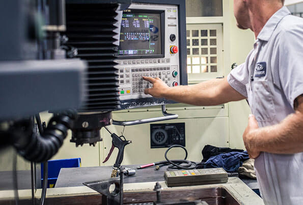 A man using a machine for low volume production services