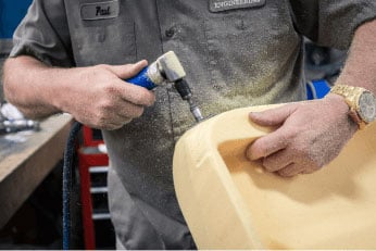 Man hardworking molded foam after custom foam molding at RCO Engineering